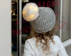 Kids Black Speckled Pom Beanie (White Light Up Pom) -Love Your Melon Black Speckled Light Up Kids Pom Beanie Model Crop
