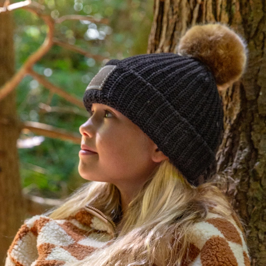 Kids Black Pom Beanie (Natural Pom) 2 Kids Black Pom Beanie (Natural Pom) - Image 2
